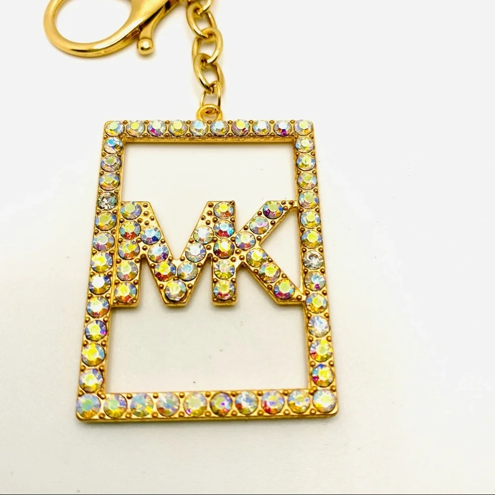 Purse Charm Key Chain MK in Iridescent Crystals set in golden tone. BRAND NEW